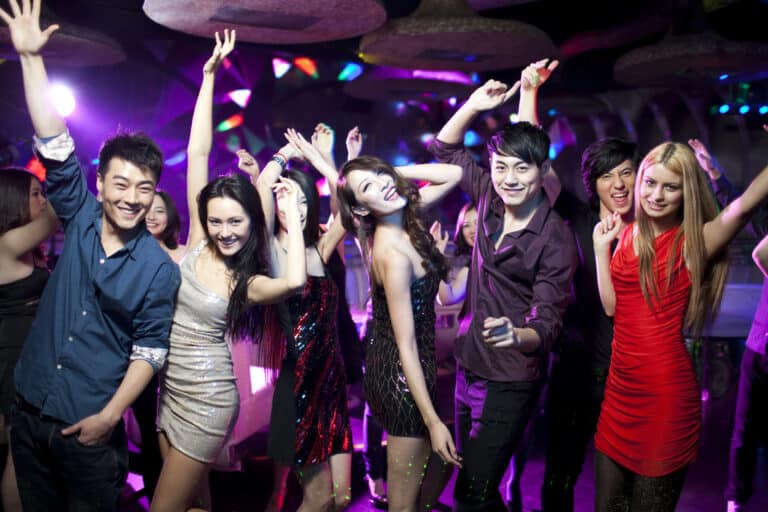 Stylish young people dancing in nightclub