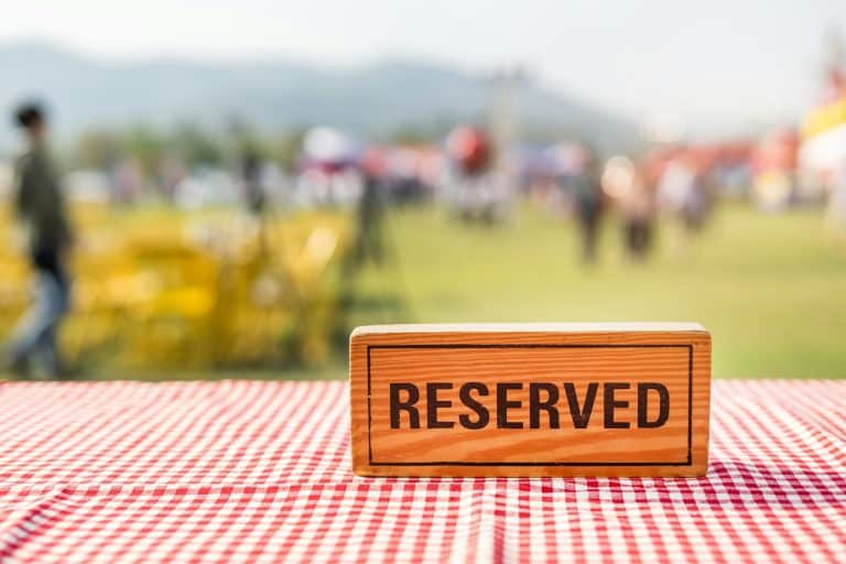Reserved wooden sign on outdoor table in event