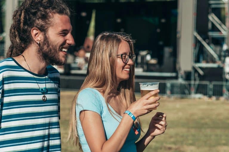 Young couple dancing at summer music festival