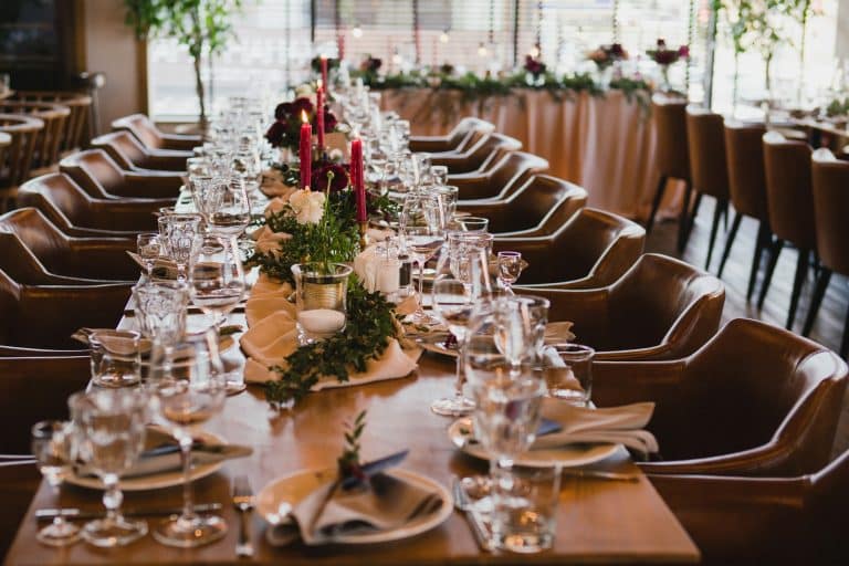 Coziness and style. Modern event design. Table setting at wedding reception.