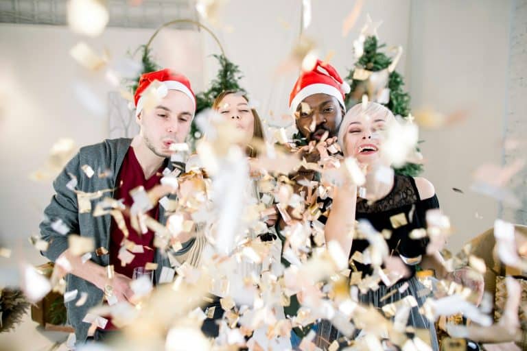 Group of friends laughing on Christmas Party.